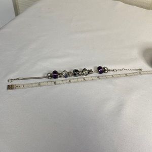 Purple and silvertone add a bead style bracelet